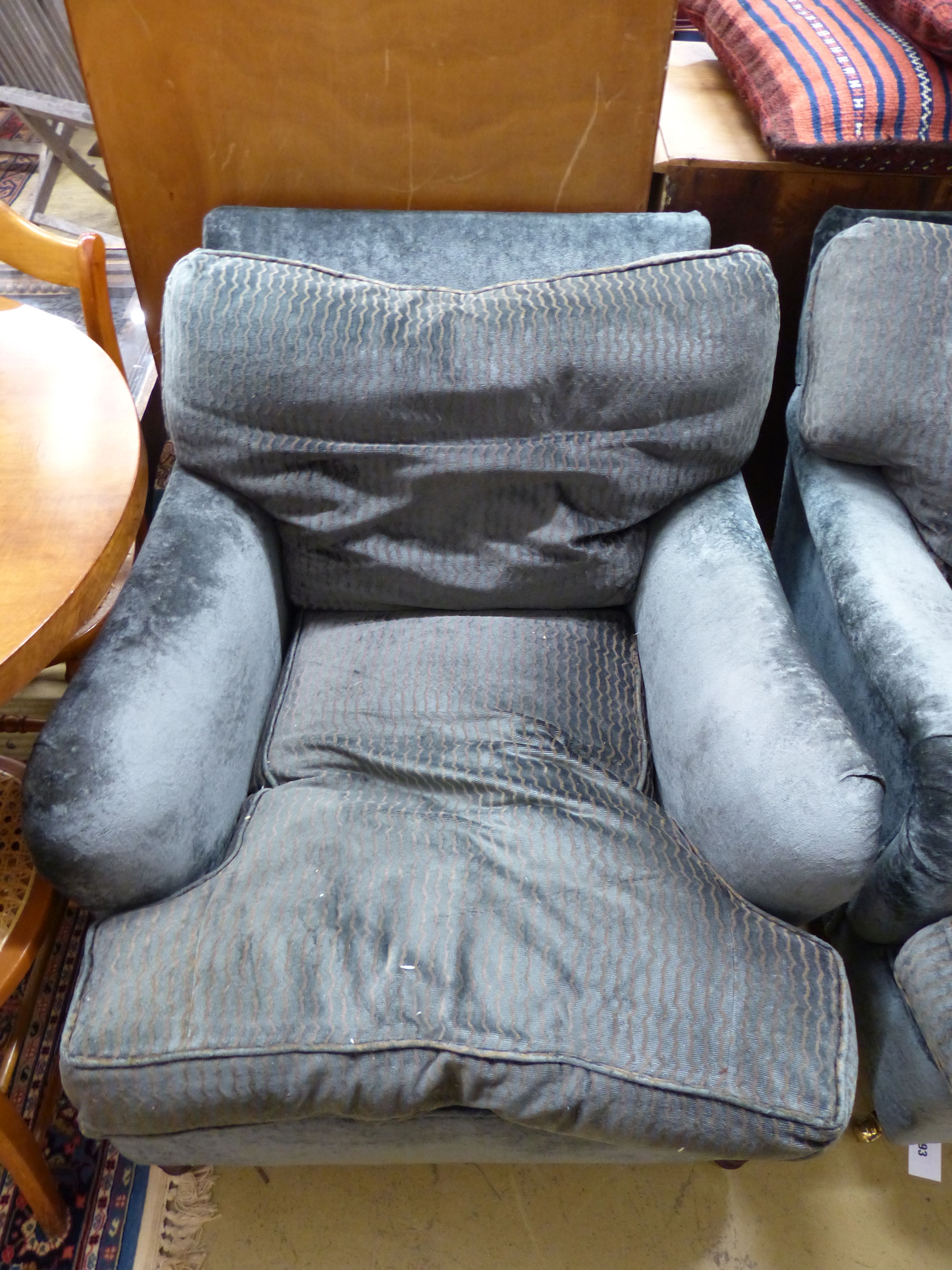 Two George Smith club armchairs in matching upholstery